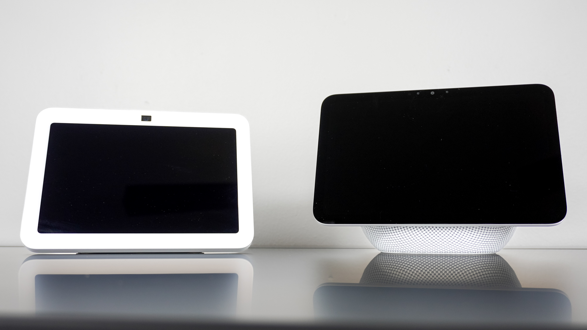 The Echo Show 8 (3rd Gen) next to the Echo Show 8 (4th Gen) on a desk