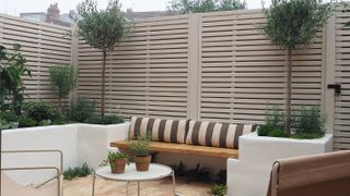 neutral painted fence in contemporary garden
