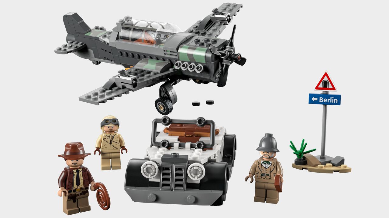Lego Indiana Jones Fighter Plane Chase parts on a plain background