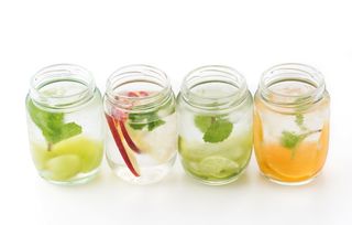 Glasses of water infused with fruit.