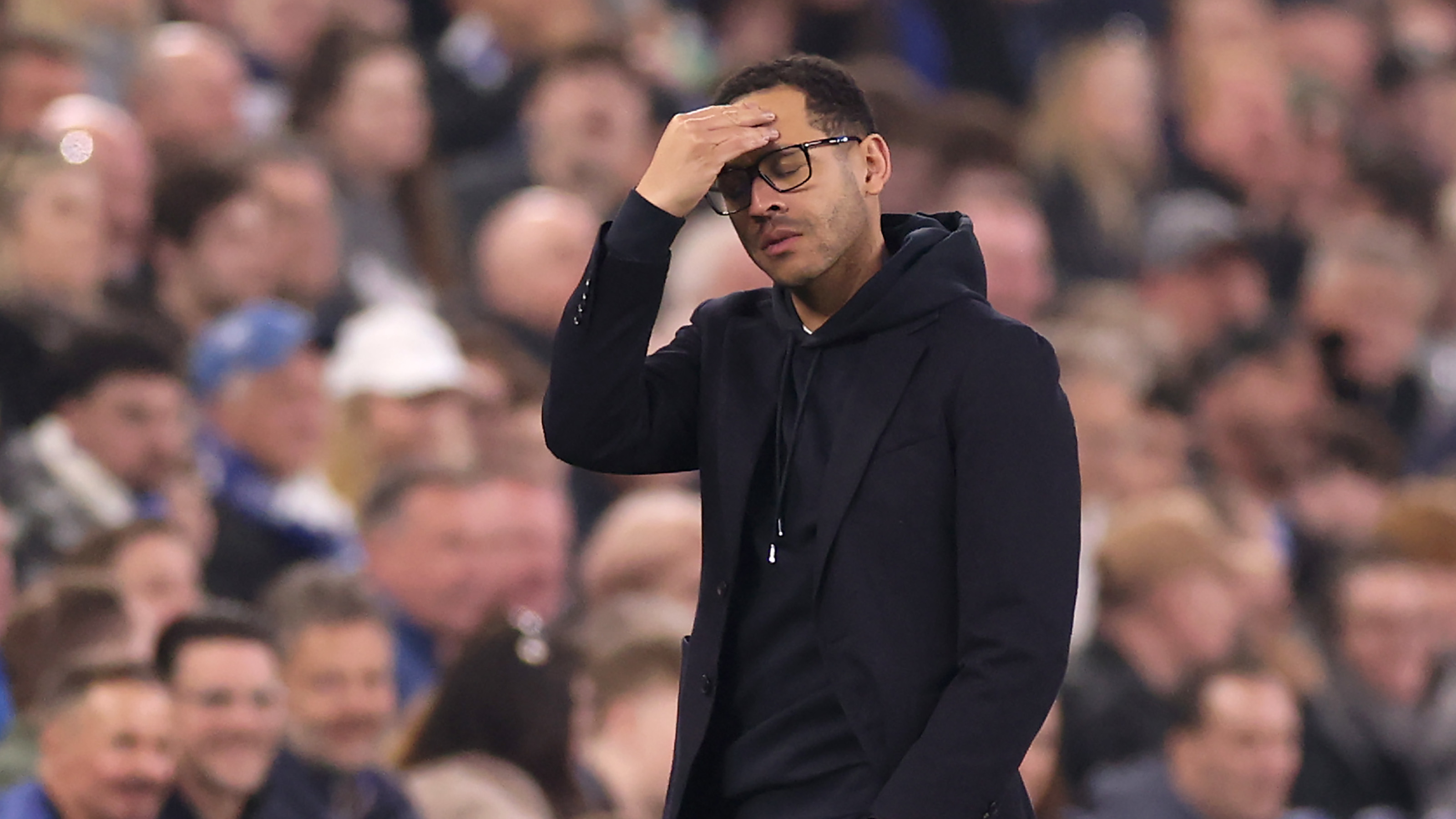 Chelsea manager Liam Rosenior puts his hand to his head during the defeat to Everton