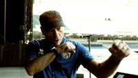Bruce Dickinson making a punching motion