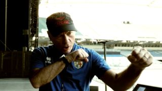 Bruce Dickinson making a punching motion