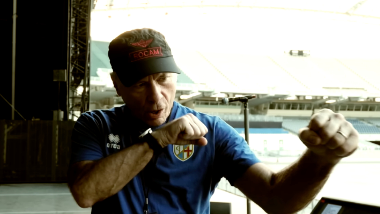 Bruce Dickinson making a punching motion
