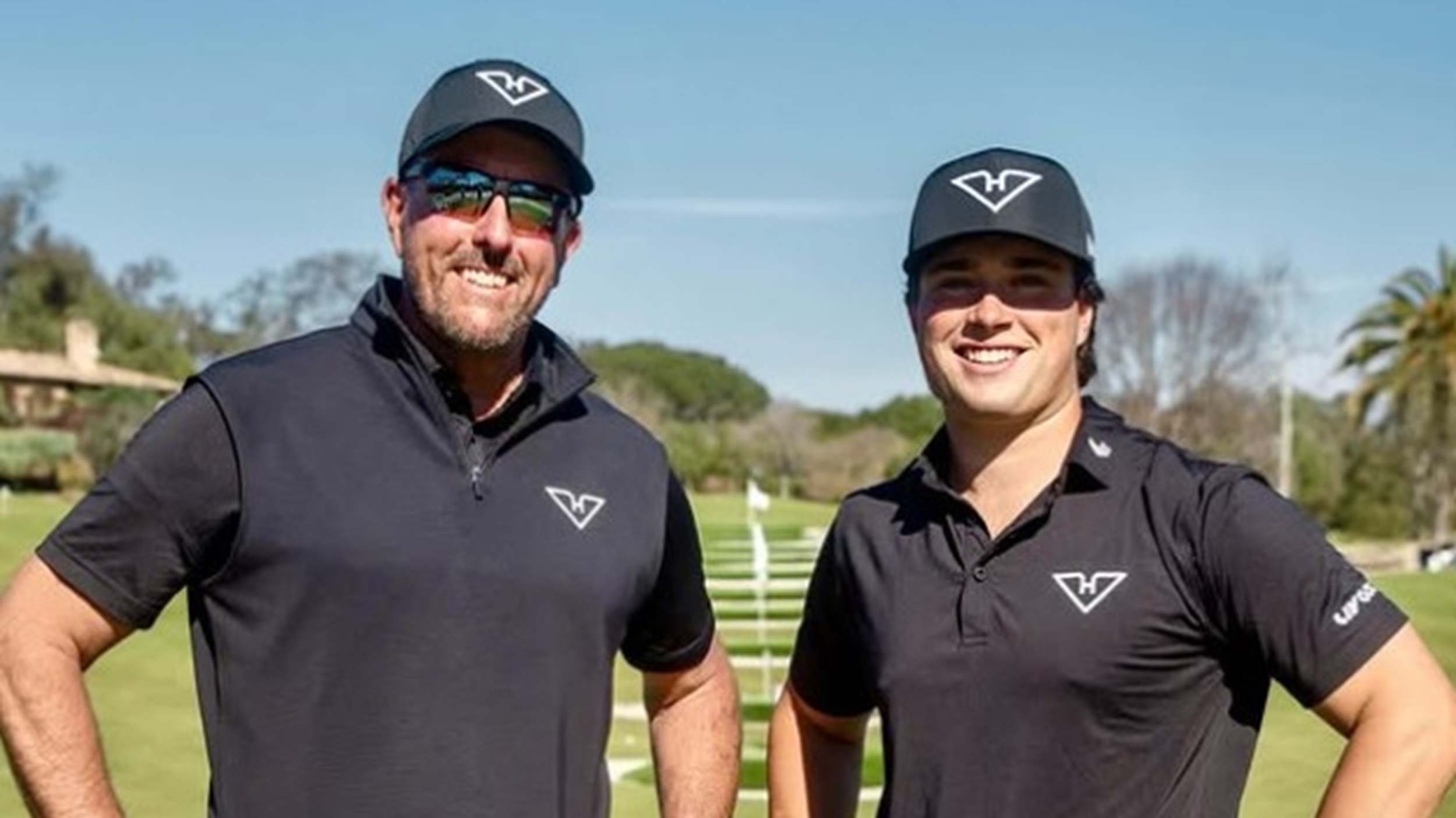 Michael La Sasso with Phil Mickelson after signing for LIV Golf