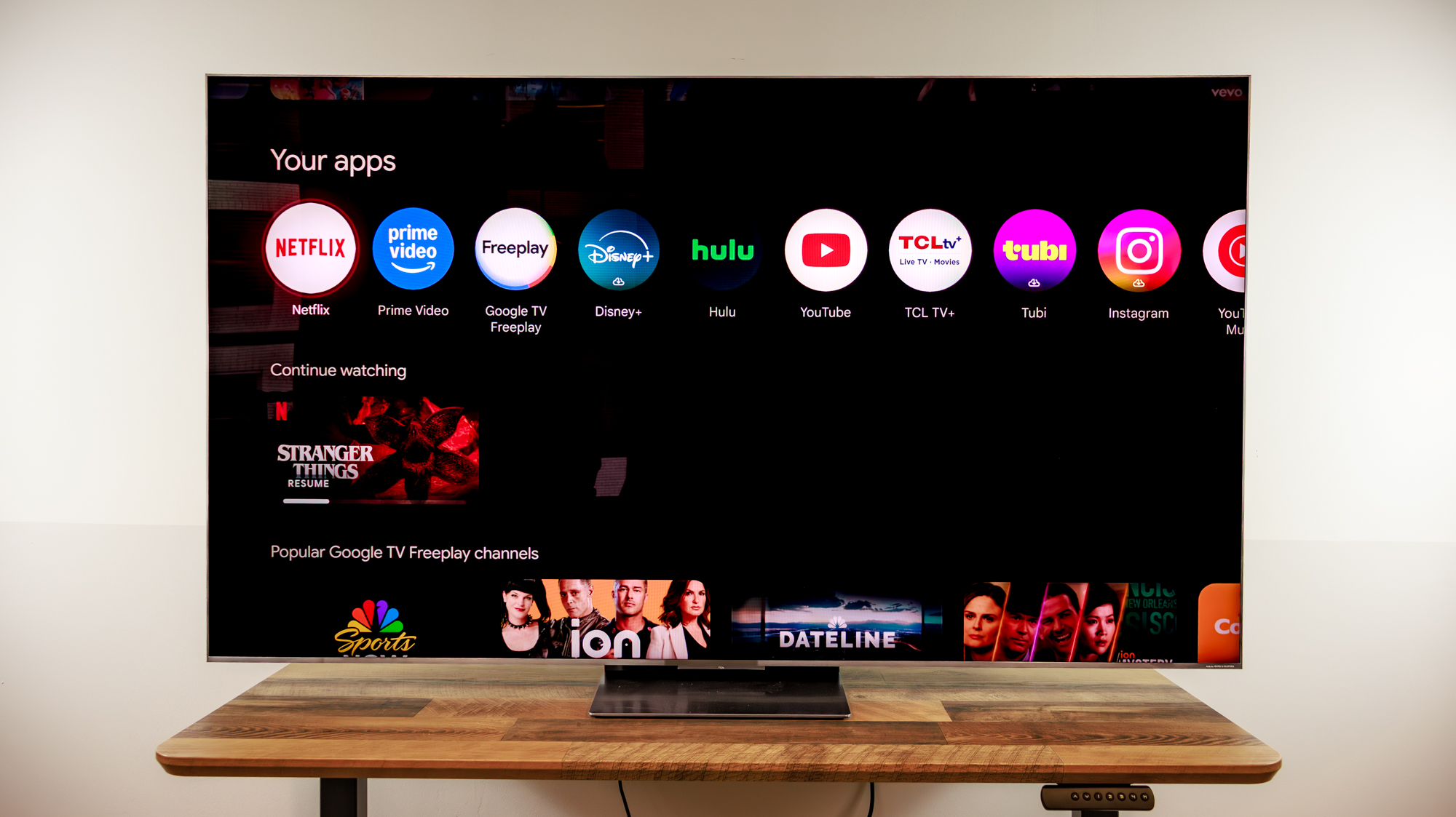 A TCL QM8L TV on a desk