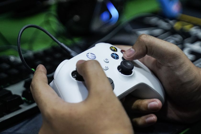 Xbox controller in hands.