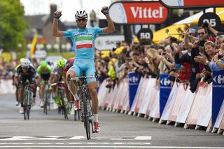 Italys Vincenzo Nibali celebrates as he crosses the finish line at the end of the 201 km second stage of the 101st edition of the Tour de France cycling race on July 6 2014 between York and Sheffield northern England AFP PHOTO ERIC FEFERBERG Photo credit should read ERIC FEFERBERGAFP via Getty Images