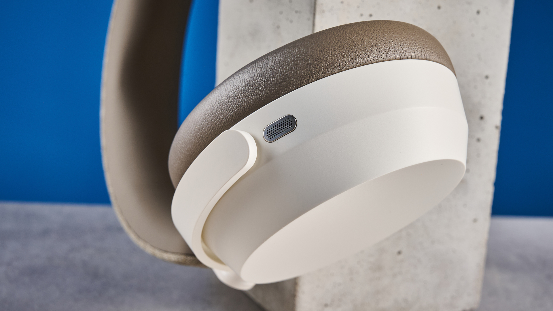 the sennheiser momentum 5 in white photographed against the blue tom's guide background