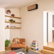 Wood-effect finished air conditioning unit from Daikin's Stylish range, wall-mounted in a living room