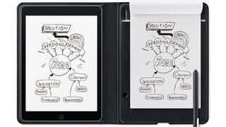 Wacom tablet's screen mirrors the sketch drawn on a paper notebook beside it
