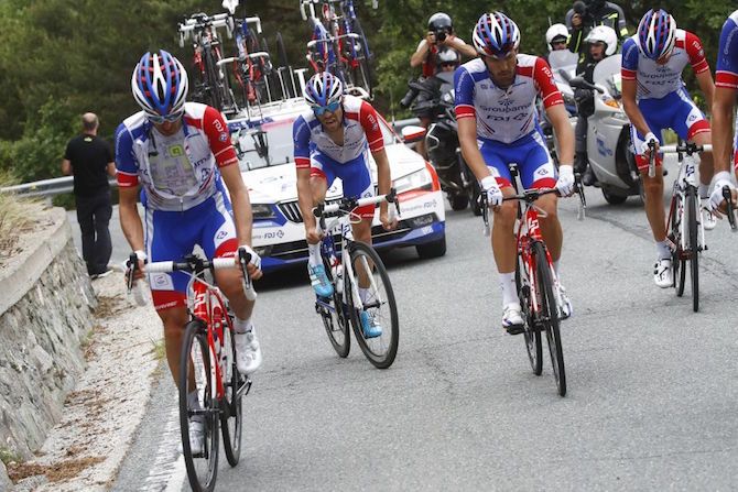A distressed Thibaut Pinot, with the assistance of his Groupama-FDJ teammates, tries to make it through stage 20 of the Giro, but would head to hospital later that evening suffering from dehydration and exhaustion