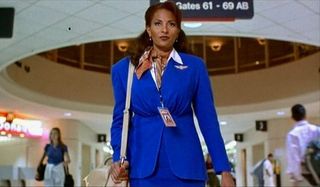 Jackie Brown walking through the airport, in her uniform