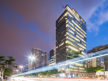 High rise building pictured at night