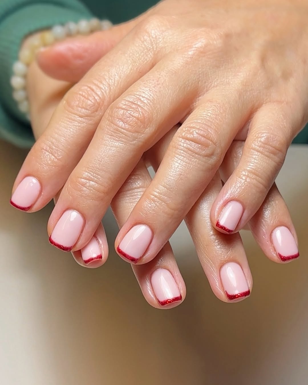 sparkly red french manicure