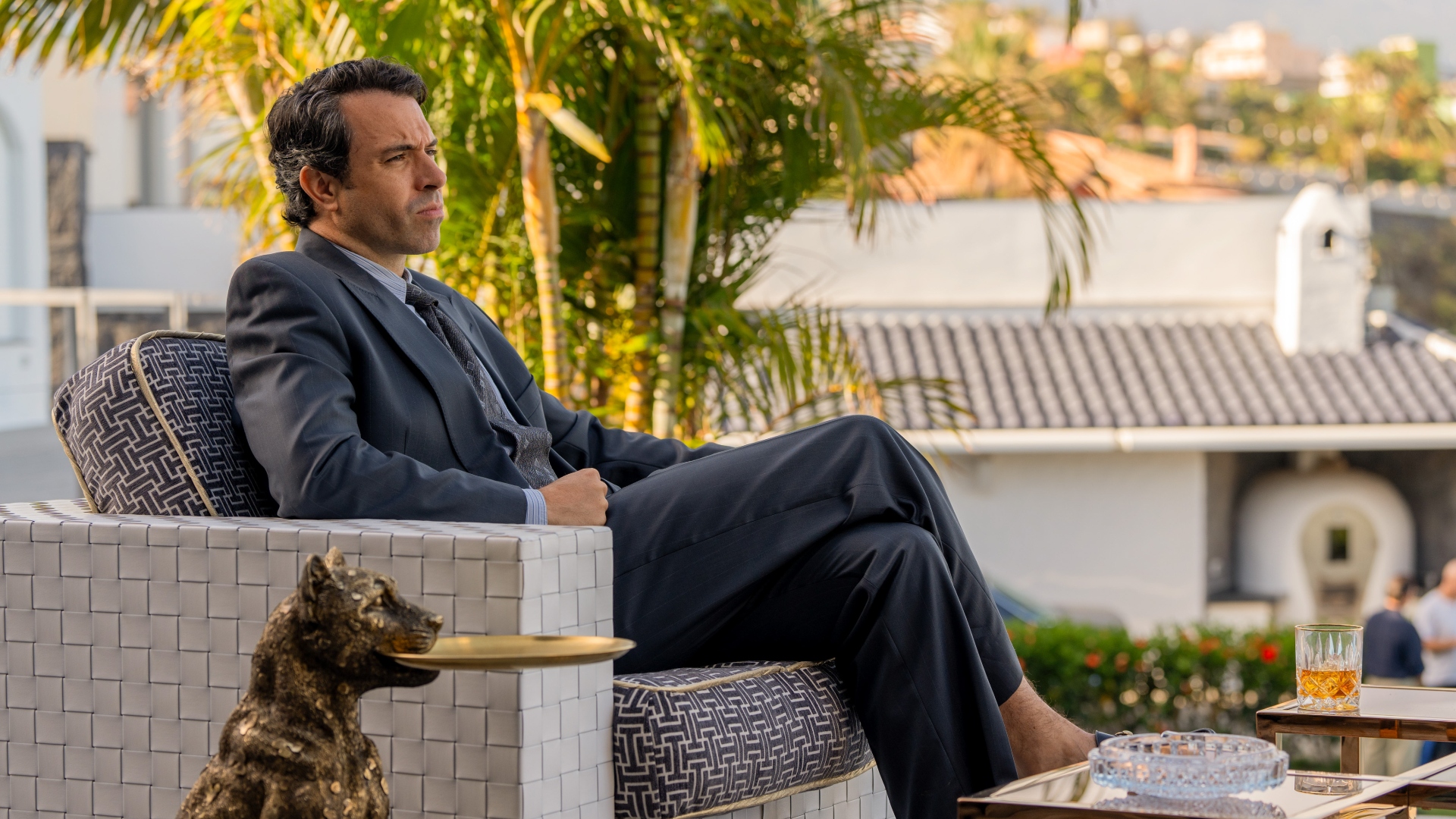 John sits outside in The Gold season 2