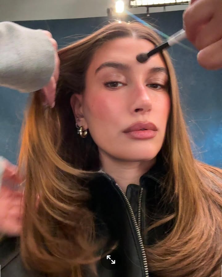 Selfie of Hailey Bieber as she gets her makeup and hair done.