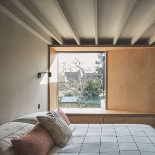 bedroom with window seat and large picture window