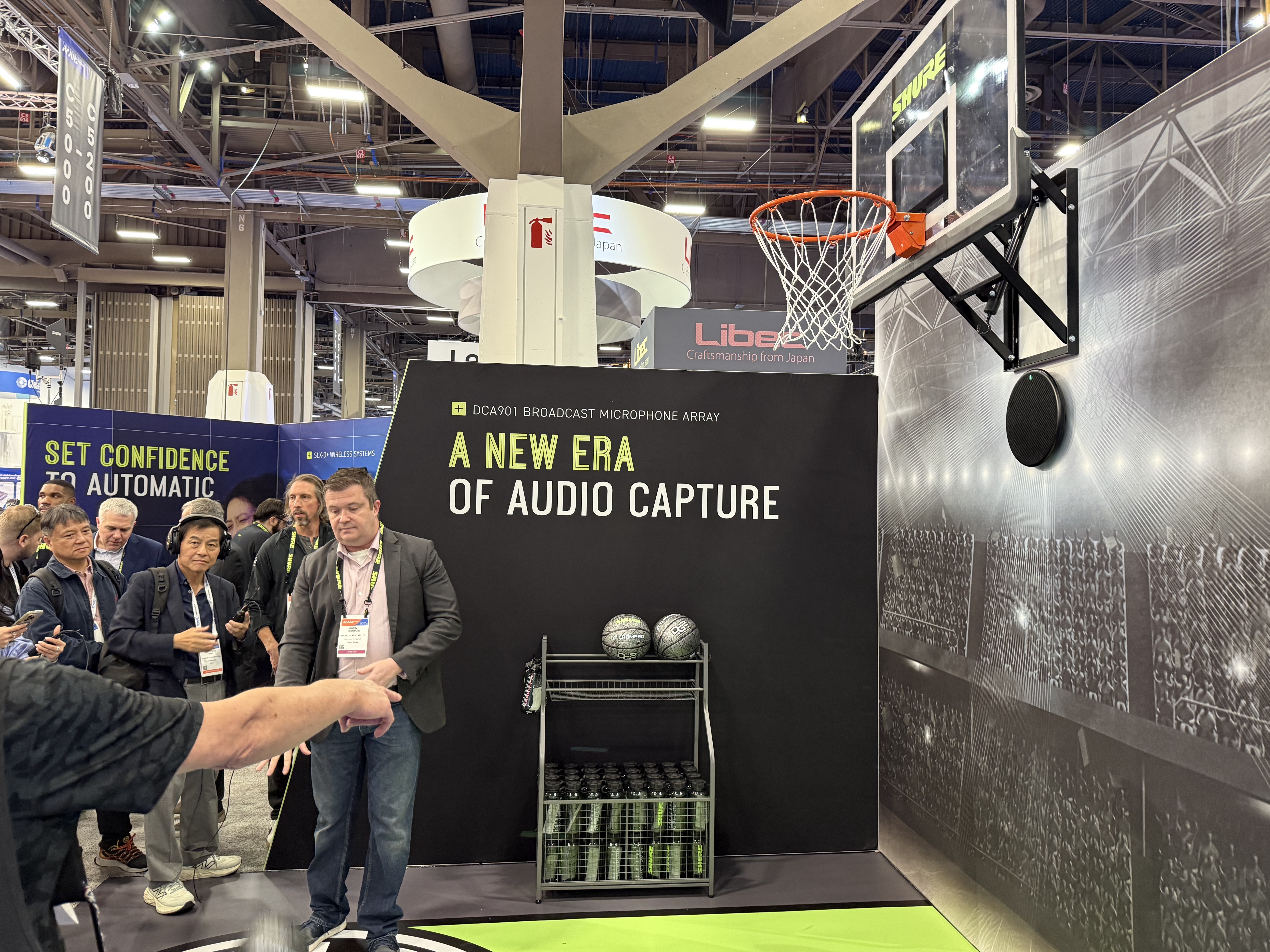 Views from the NAB Show 2026 show floor including wrestlers, Shure audio, a mock production set, and Roger and James Deakins.