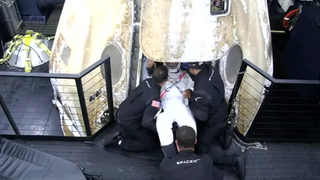 NASA astronaut Victor Glover emerges from the Crew Dragon.