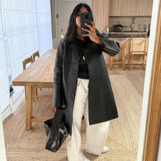 An image of @monikh wearing a chic shoe with ankle-length trousers.