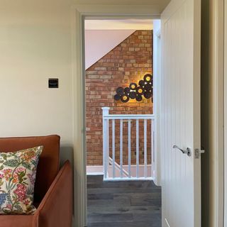 Cottage style panelled internal fire door with three fire rated hinges and seals in loft conversion