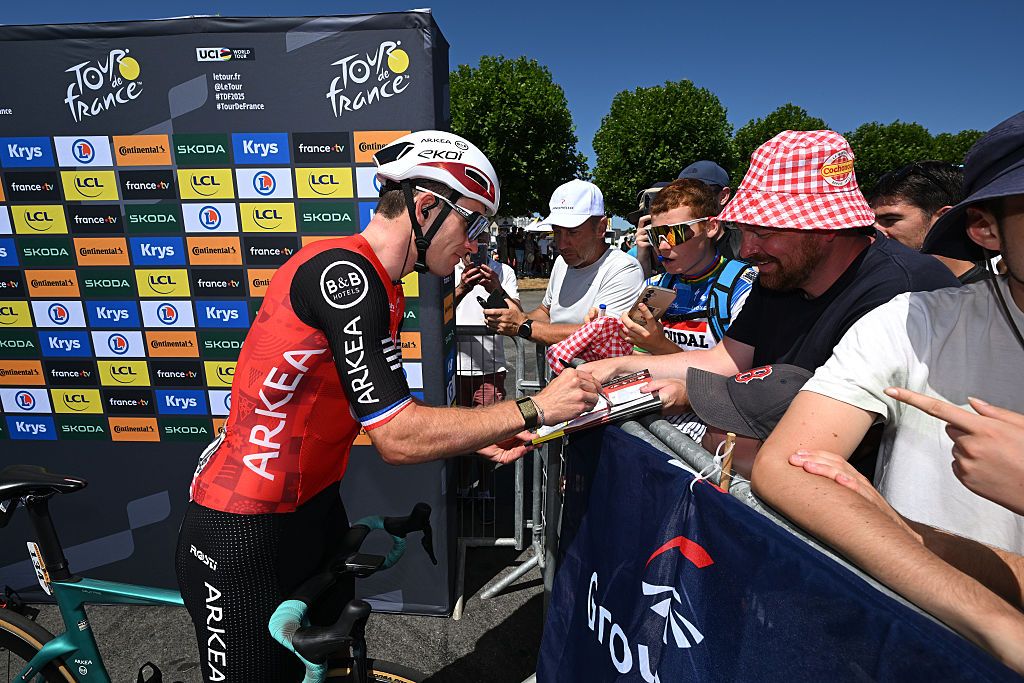 SAINT-MEEN-LE-GRAND, FRANCE - JULY 12: Arnaud Demare of France and Team Arkea - B&amp;B Hotels signing autographs prior to the 112th Tour de France, Stage 8 a 197km stage from Saint-Meen-le-Grand to Laval (Espace Mayenne) / #UCIWT / on July 12, 2025 in Saint-Meen-le-Grand, France.