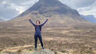 Julia Clarke standing on a rock in Glencoe