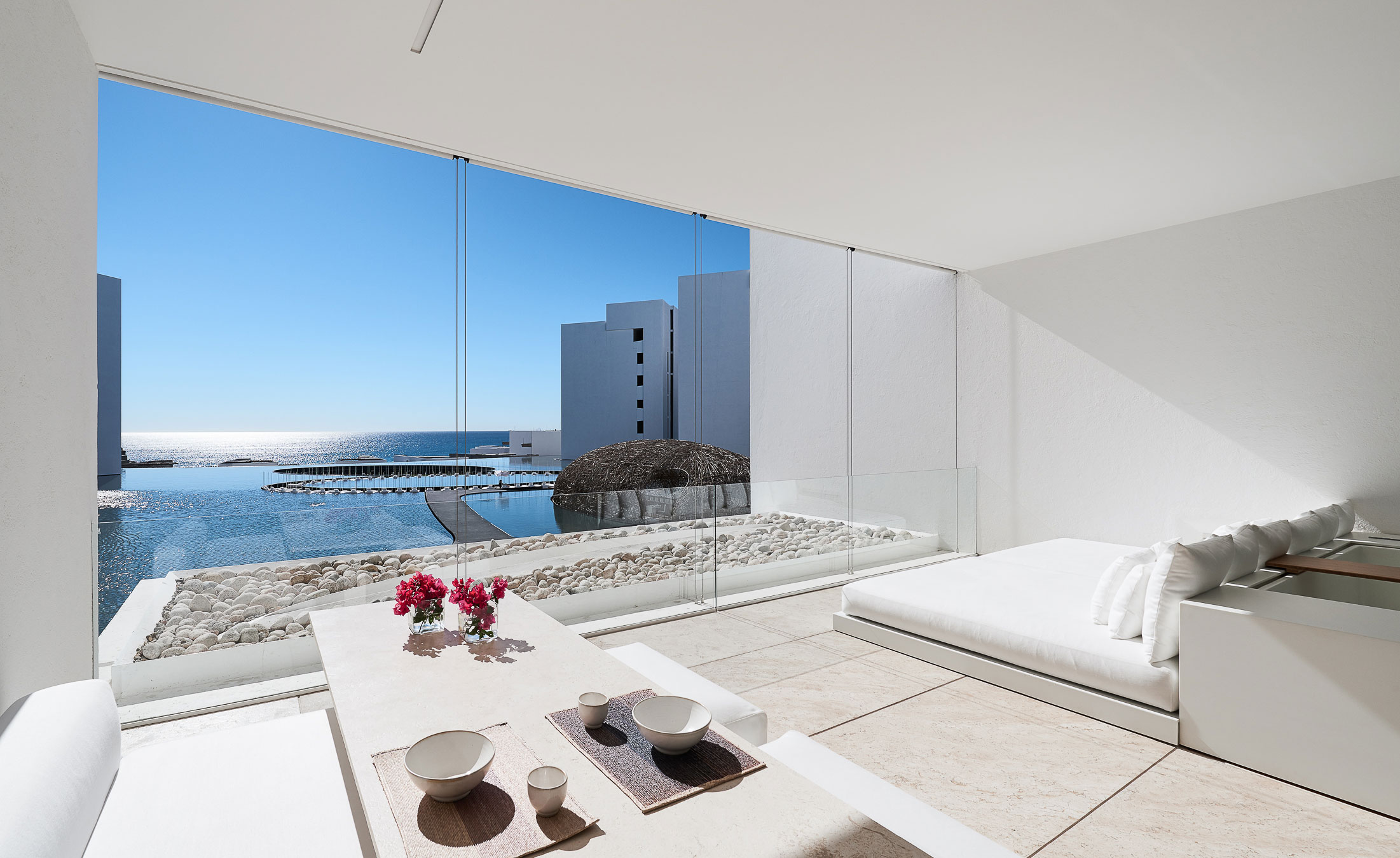 Sunroom receives light from large open windowed section