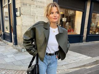 Fashion influencer @sabinasocol in Paris wearing a polished outfit with jeans.