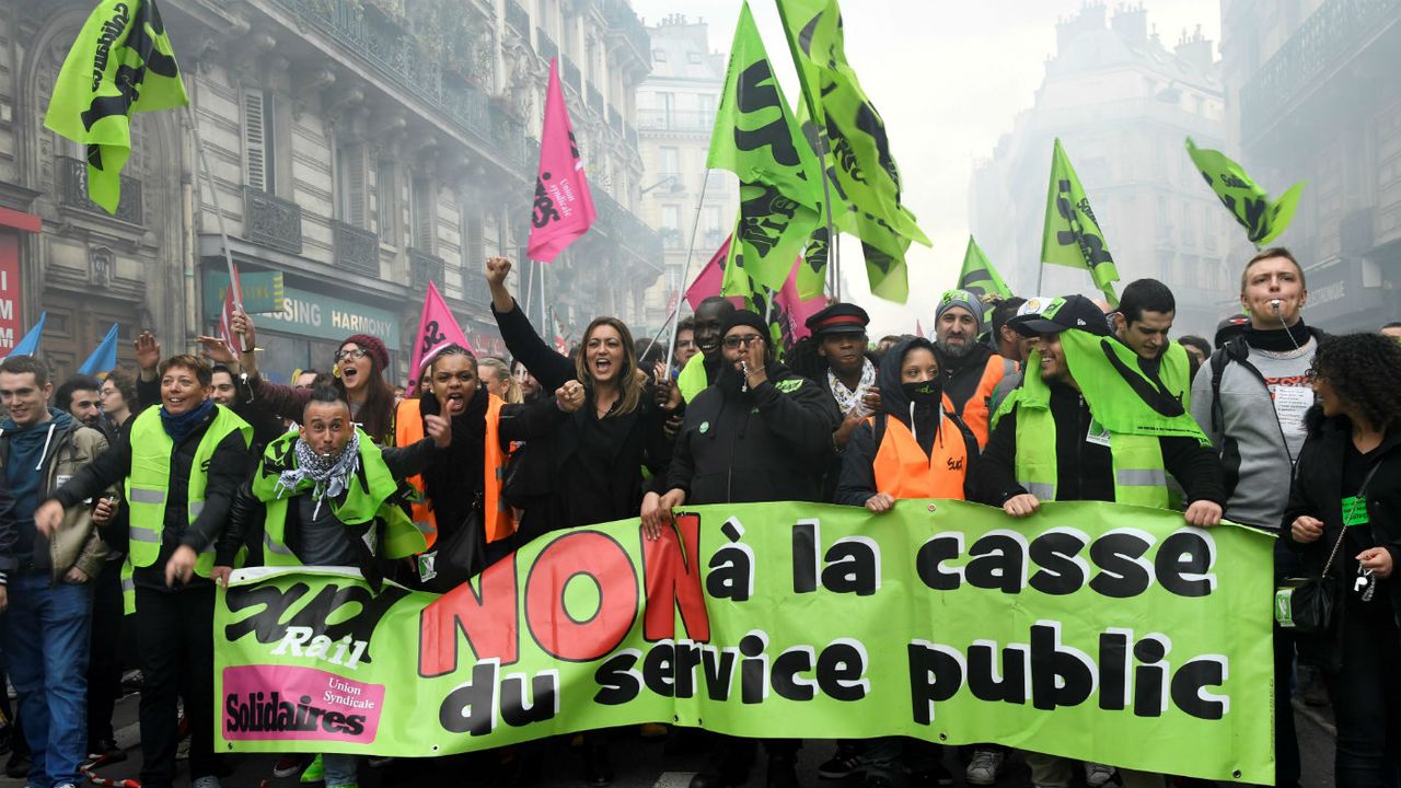 Protestors carry a banner reading &amp;#039;No to public service cuts&amp;#039; during a demonstration in Paris on Tuesday