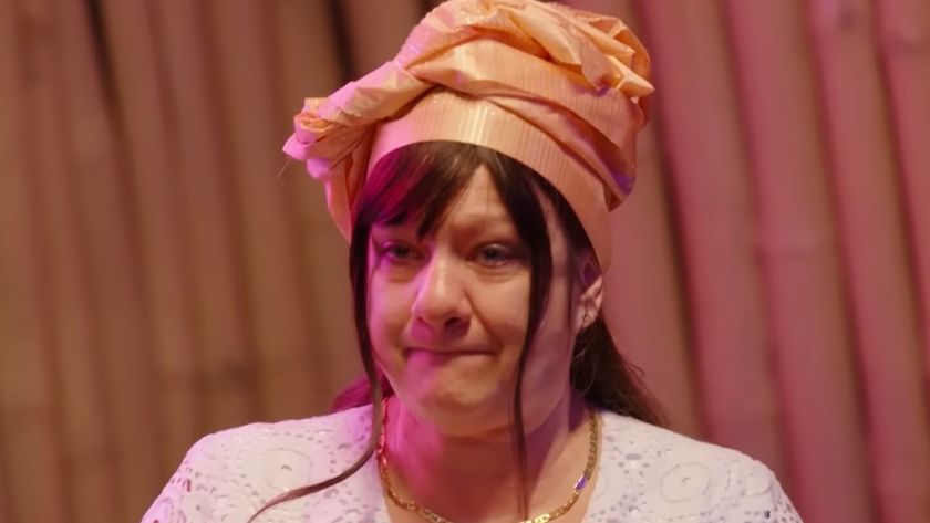 Lisa in Nigerian ceremonial dress talking to Daniel's uncle