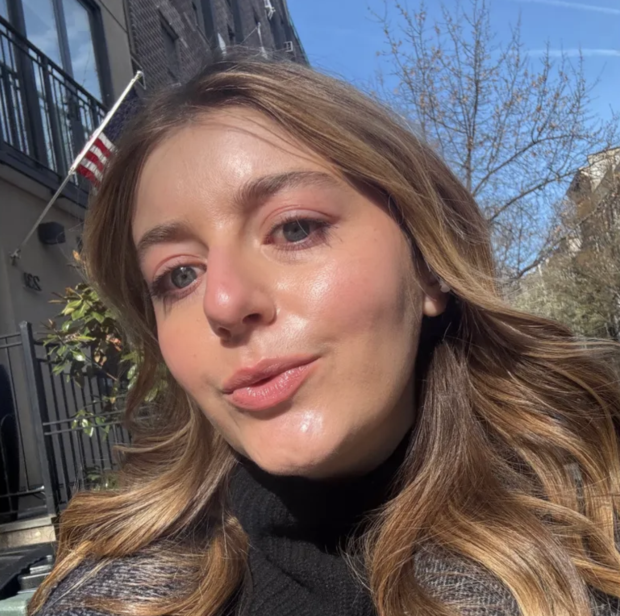 a girl with brown and blonde hair after using the Chantecaille Just Skin Tinted Moisturizer SPF 15.