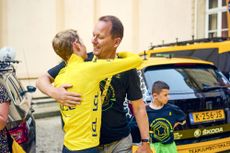 Coach Tim Heemskerk congratulates Jonas Vingegaard on winning the Tour de France