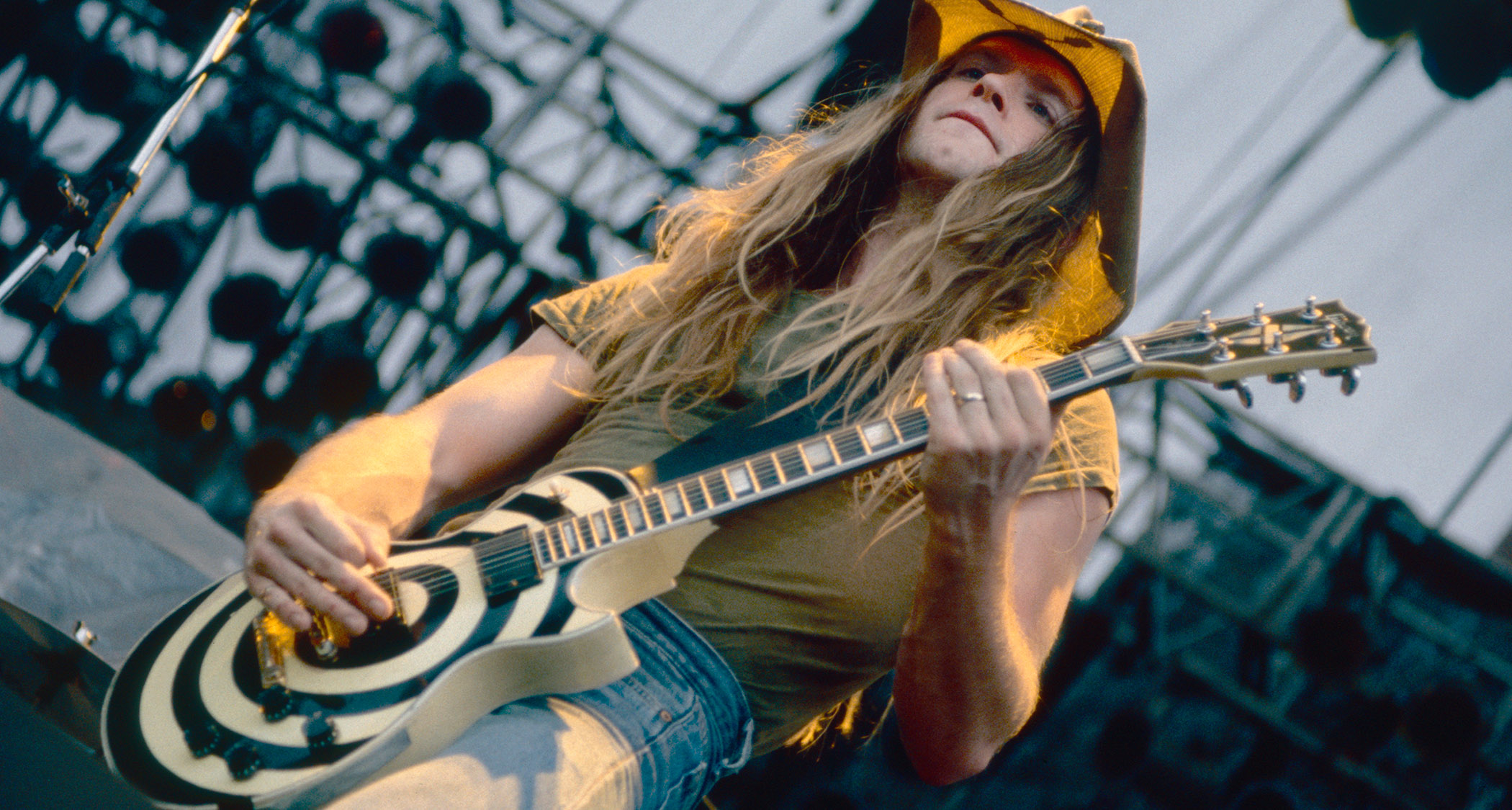 Zakk Wylde with his bullseye graphic Les Paul Custom, aka the Grail, playing live outdoors with Pride &amp; Glory in 1994.