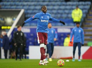 Kurt Zouma warmed up before dropping out of West Ham's starting XI for Sunday's Premier League game at Leicester
