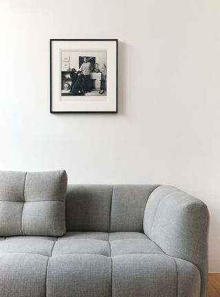 grey sofa and photo frame on the wall
