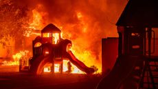 A playground burns during a wildfire in a residential neighbourhood of Altadena, north of Los Angeles