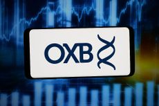 British small-cap stocks: Logo of Oxford Biomedica on a smartphone screen
