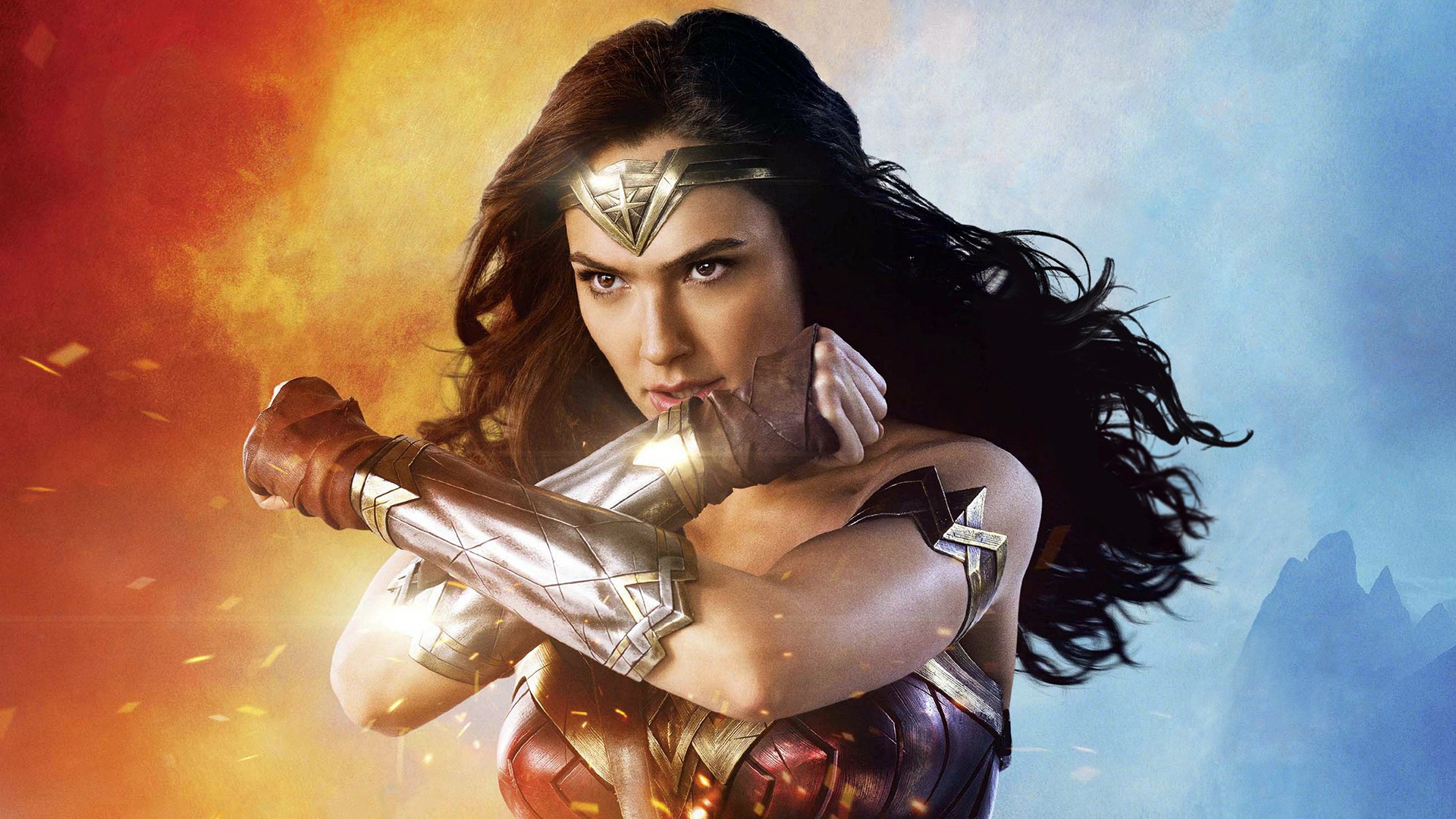Wonder Woman crosses her arms to form her iconic pose in a promotional image from Wonder Woman 1984