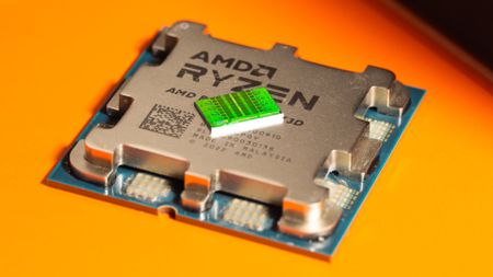 A close-up photo of an AMD Zen 4 CCD chiplet resting on top of an unidentifiable Ryzen 7000-series X3D processor, as shot by Fritzchens Fritz