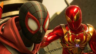 Peter Parker and Miles Morales talk in Marvel's Spider-Man 2, with the former in the Iron Spider suit and the latter in the Spider-Cat suit