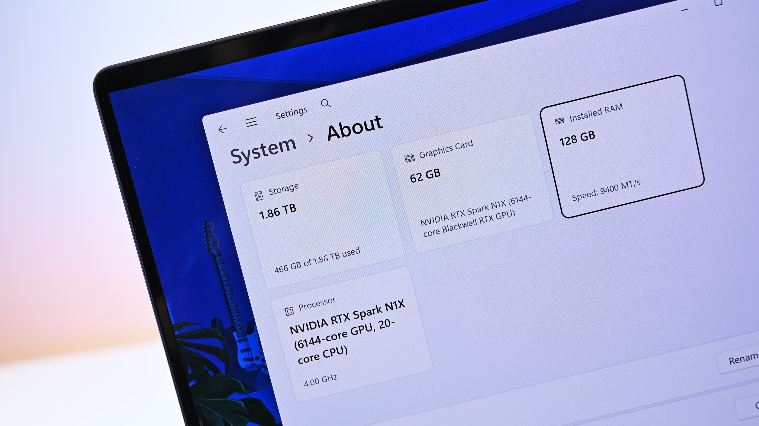 Close-up of Windows system specs showing 128 GB RAM, 1.86 TB storage, and NVIDIA RTX Spark N1X processor with 6144-core GPU and 20-core CPU.