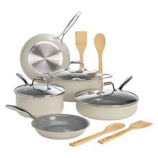 Beige pots and pans with spatulas
