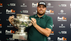 Dan Bradbury holds the Open de France trophy