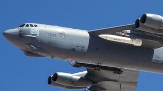 A June 12, 2019 photo shows a B-52 carrying an ARRW prototype (in white, under the left wing) during a test where it was not launched.