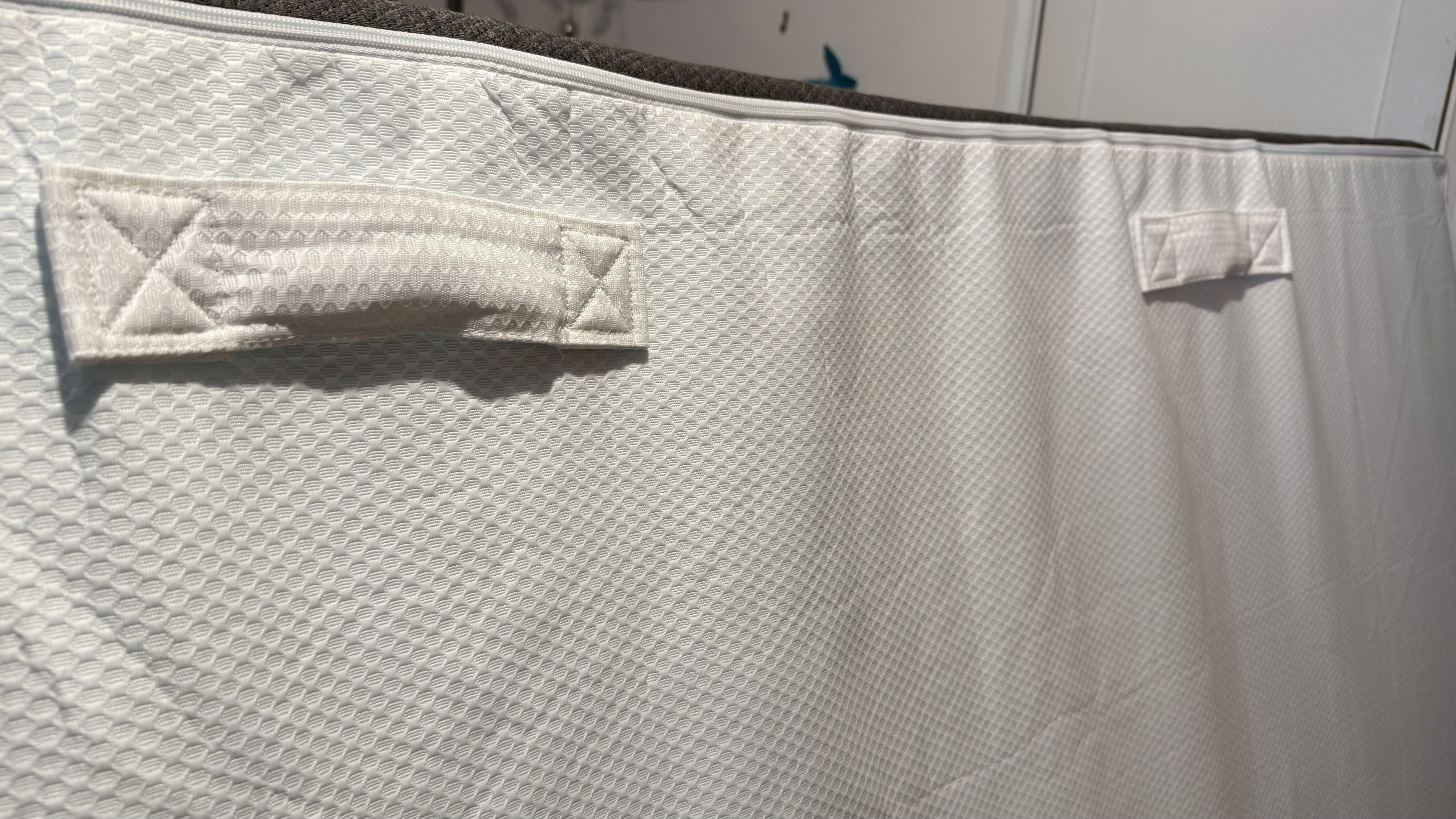 Handles on the back of the Panda Hybrid mattress