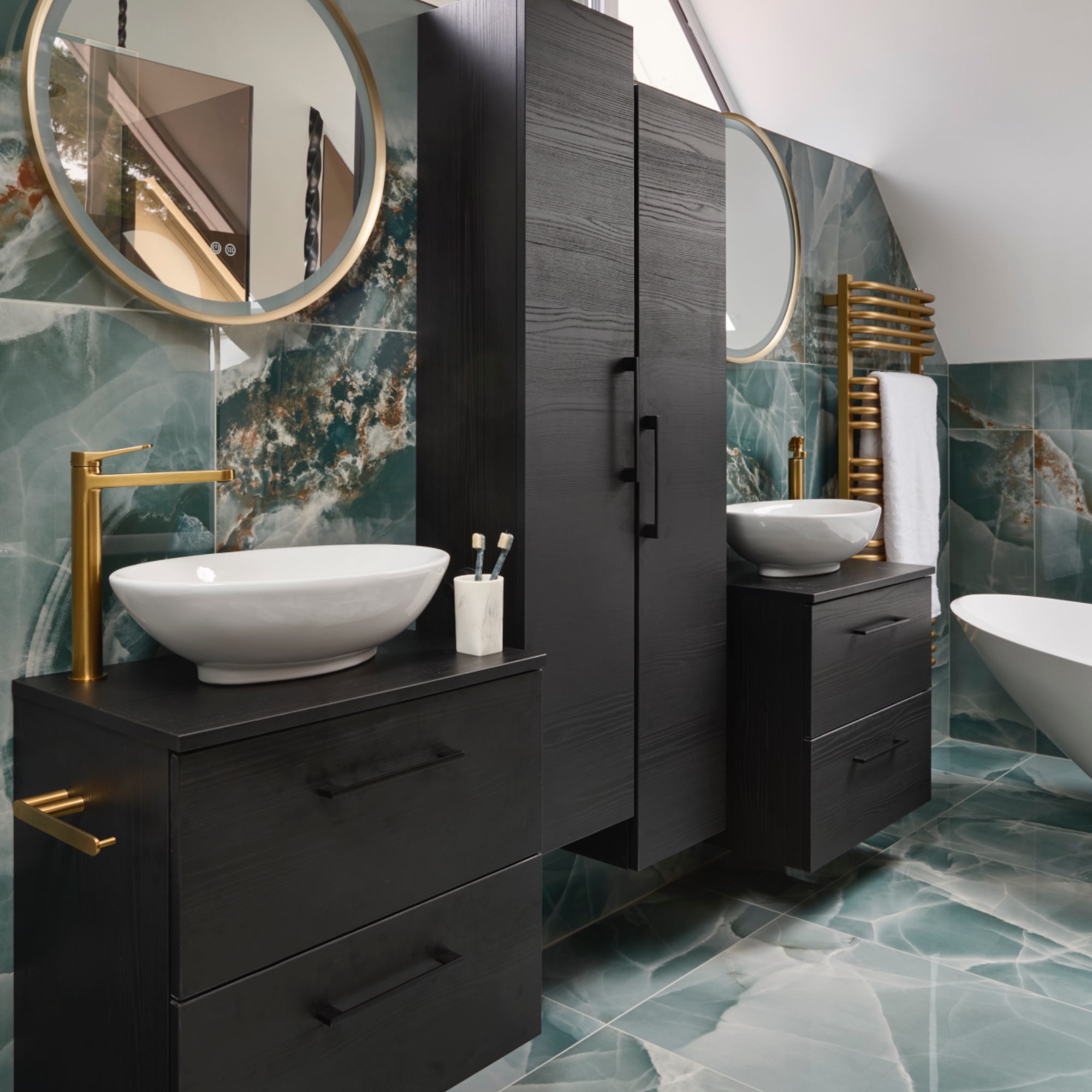 teal bathroom with fitted storage, twin basins and mirrors, teal marble floor and wall tiles