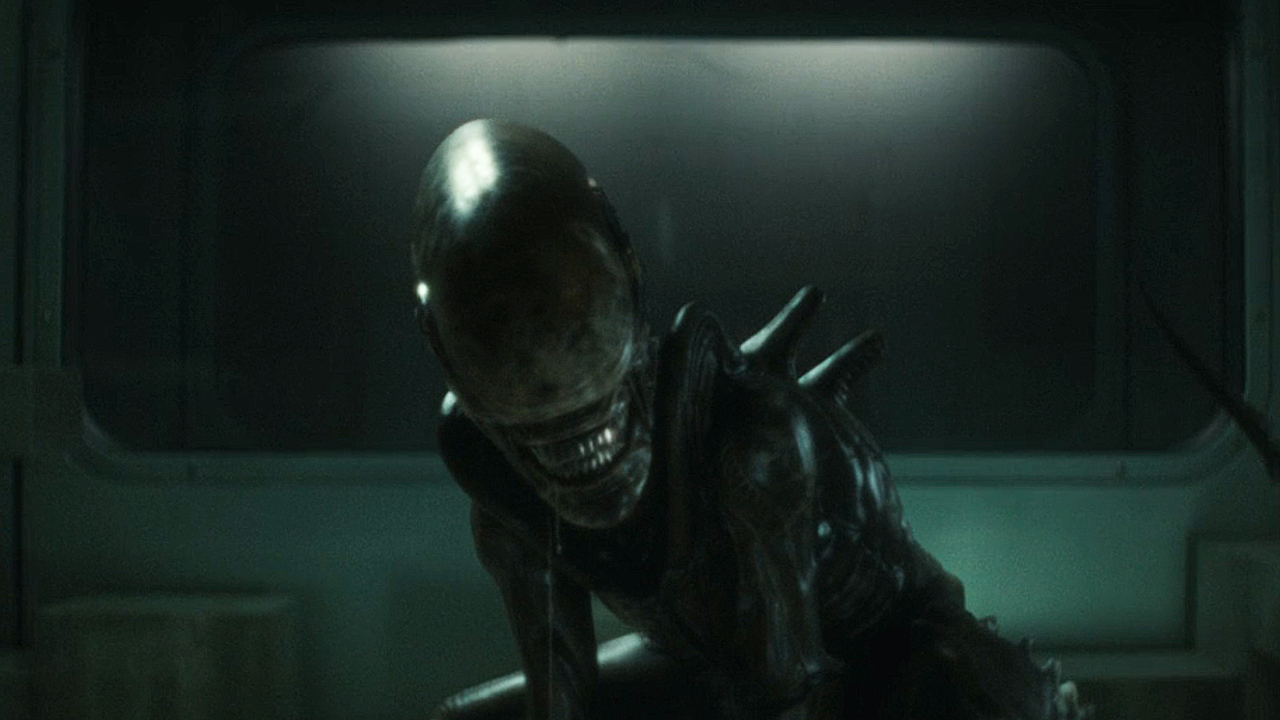 The xenomorph squatting and bearing its teeth in Alien: Earth episode 6