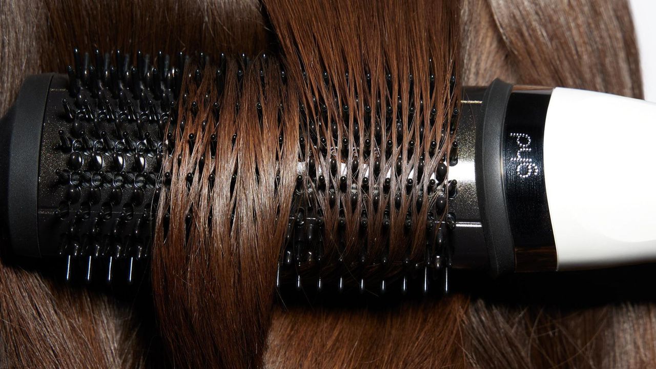 ghd duet blowdry tool with hair wrapped around it